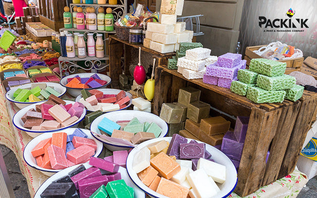 Artisanal soaps displayed at a market or pop-up.