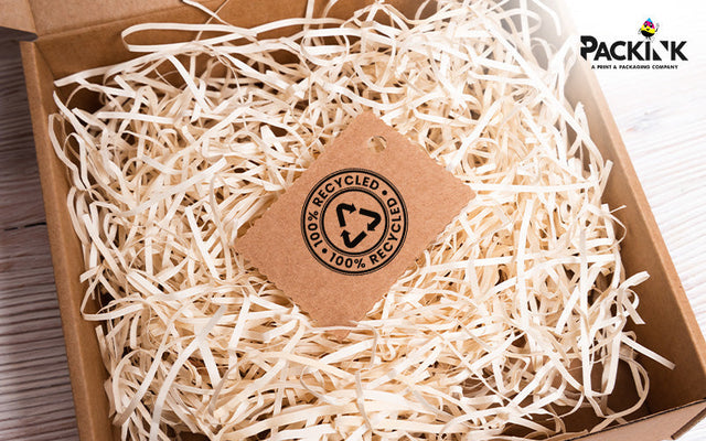 Recycled tag inside a box with wood wool fillers