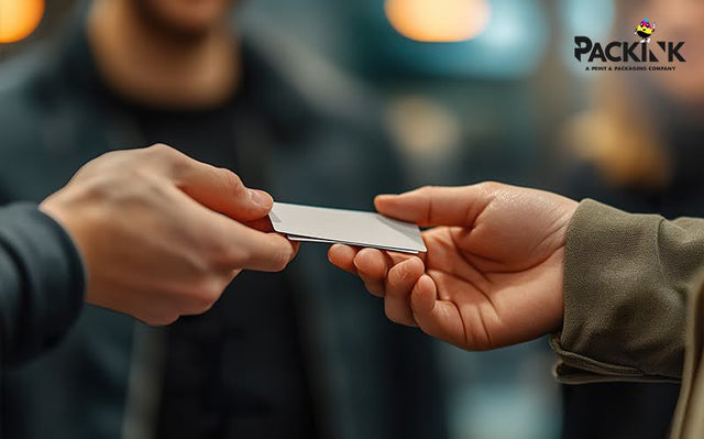 Handing a business card to a customer.